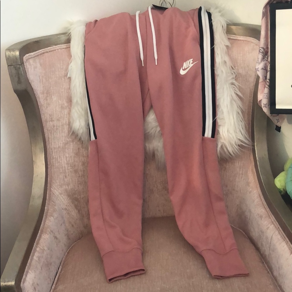 Nike jogging pants rose colored.